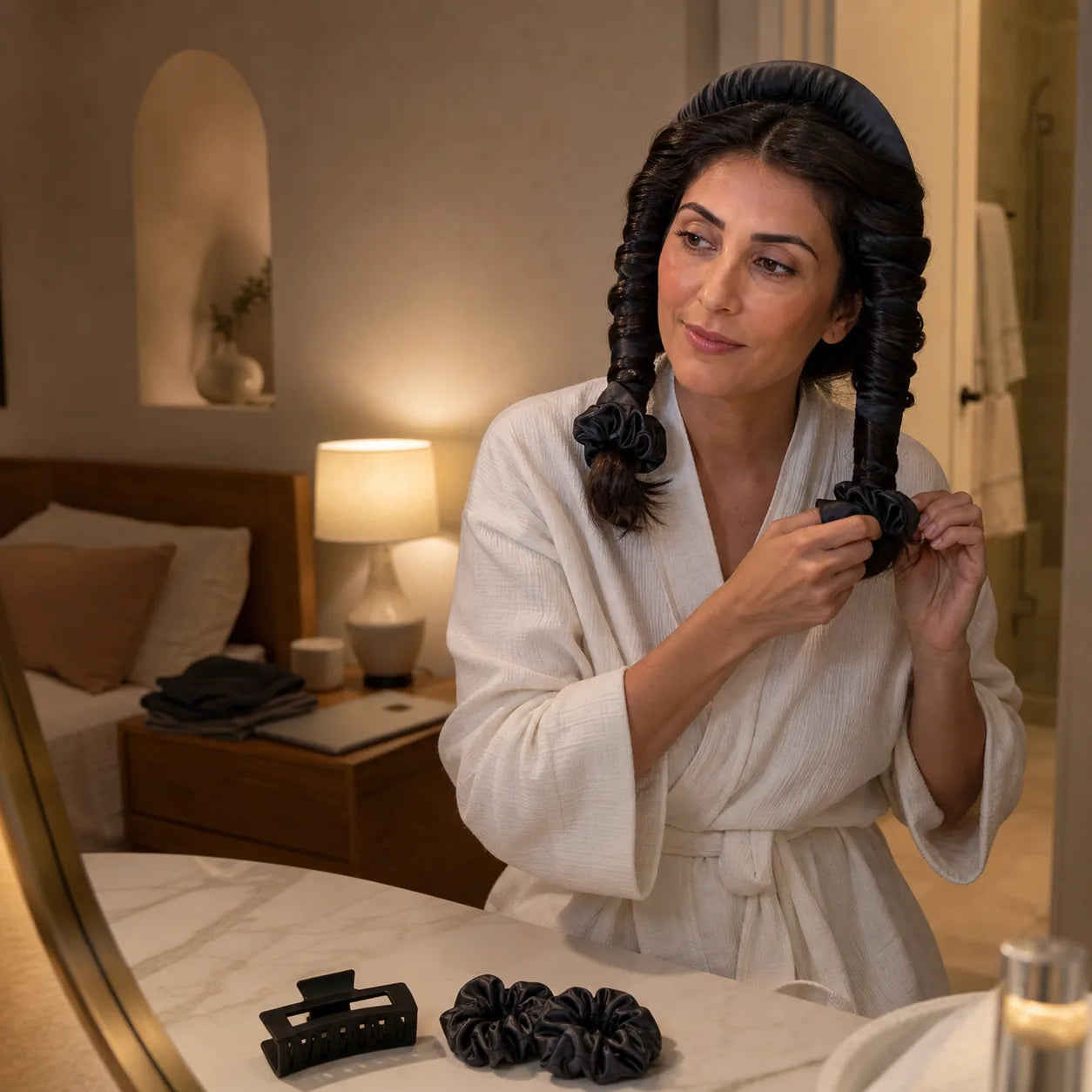 A woman securing the overnight curling set as part of her evening routine